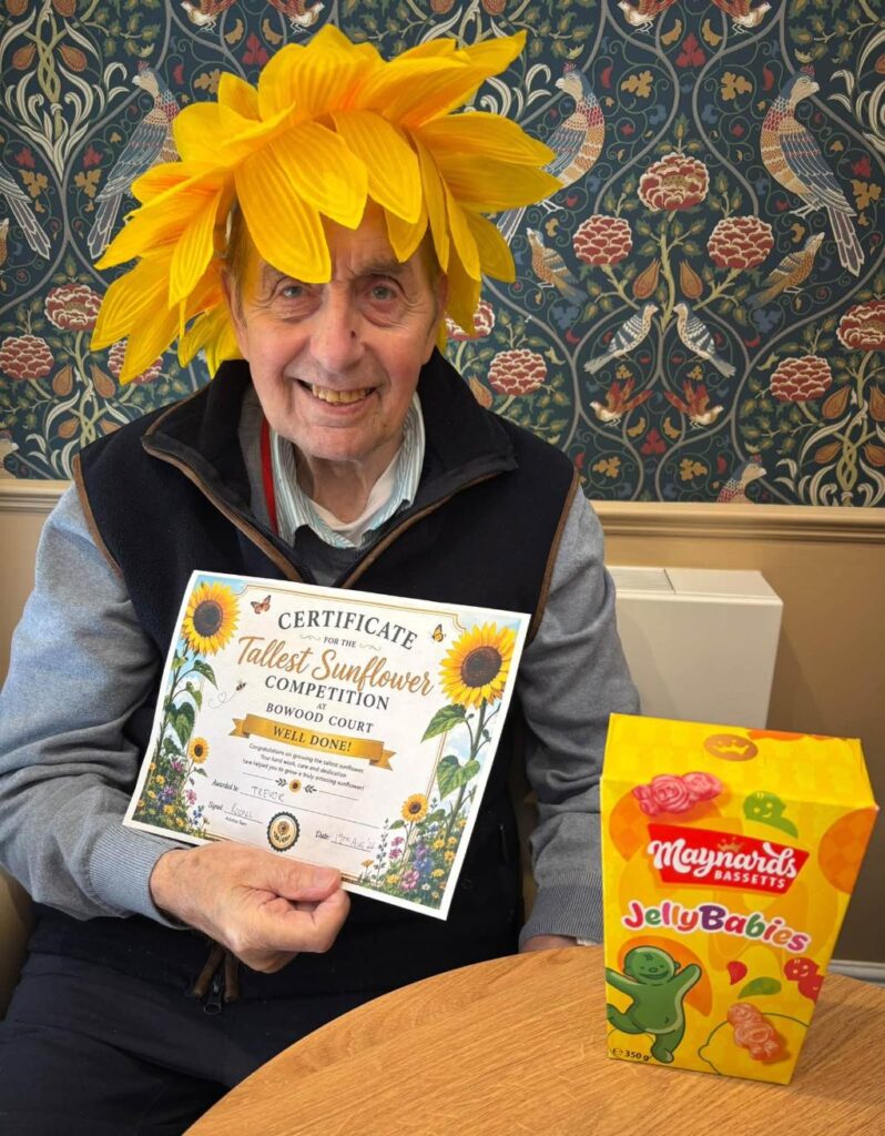 a residents with a certificate for a gardening competition
